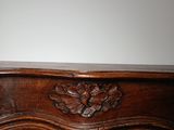 an image of a wooden table with carvings on it