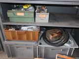 a metal shelf with a bunch of items on top of it