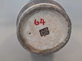 a close up of a vase with a number on it