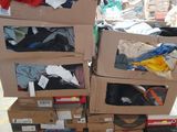 many boxes of clothes stacked on top of each other