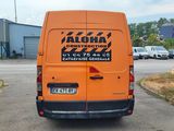 an orange van that is parked on the side of the road