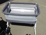 a baby crib that is sitting on the ground