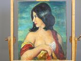 painting of a woman in a red and yellow dress is on a easel