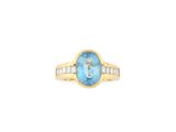 an oval blue topaze and diamond ring