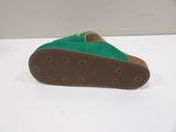 green slippers on a white surface with a white background