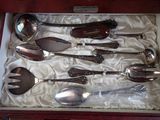 a box with a set of silver spoons and spoons in it