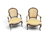 a pair of antique chairs with upholstered upholstered arms
