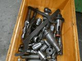 a wooden box full of tools on the floor