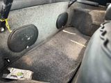 two speakers in the back of a car ' s trunk