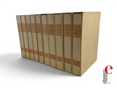 five books stacked on top of each other on a white surface