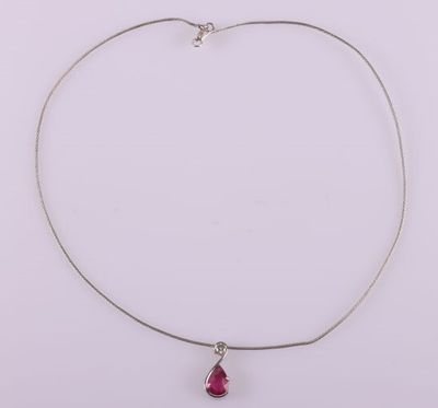 a necklace with a pink tear shaped stone on a silver chain
