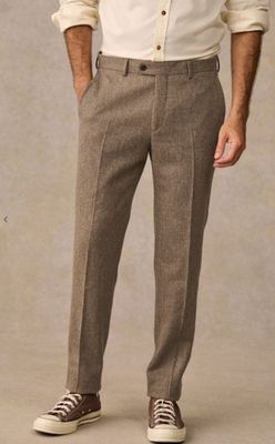 a picture of a man in a white shirt and brown pants