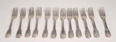 six forks are arranged in a row on a white surface