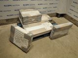several boxes of mattresses are stacked on a pallet in front of a wall