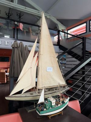 a model of a sailboat on display in a museum
