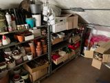 a room with a lot of boxes and containers on the shelves