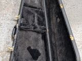 a guitar case that has been left open on the ground