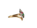a close up of a gold ring with a green and red stone