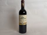 a bottle of wine that is sitting on a table