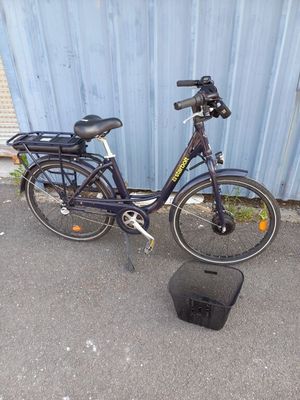 a bike that is parked next to a box