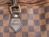 a close up of a brown and black bag