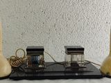 two telephones sitting on top of a table