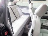 a picture of the inside of a car with the door open
