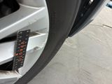a close up of a tire with a sticker on it