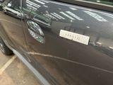 a close up of a car door with a sticker on it