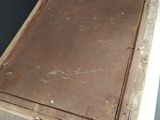an old book sitting on top of a wooden table