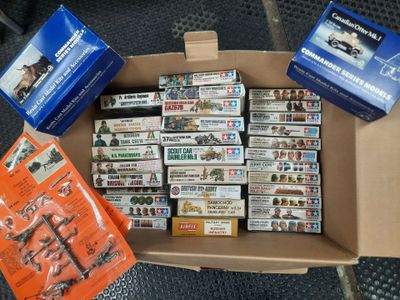 a cardboard box filled with many different types of dvds