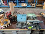 a lot of tools on a table in a warehouse
