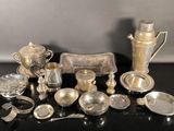 a lot of silver items that are on a table