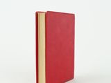 the red book is open on a white surface