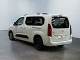 a picture of a white van parked in a showroom