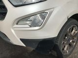 a close up of the front of a white car