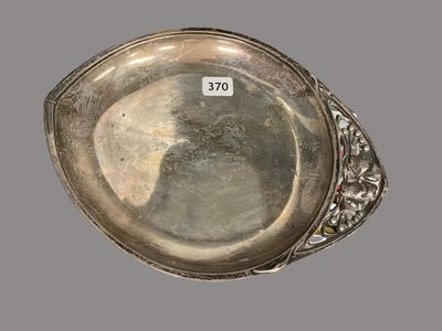 an antique silver plate with a silver band around the edge