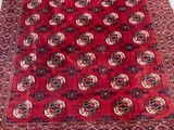 an image of a red rug with a pattern on it