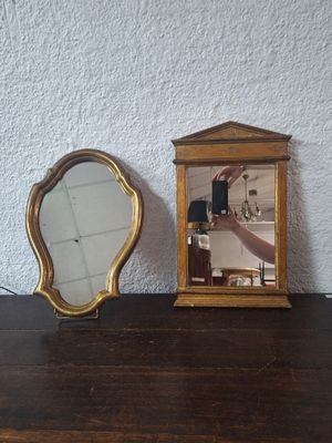 a small mirror and a small mirror on a table