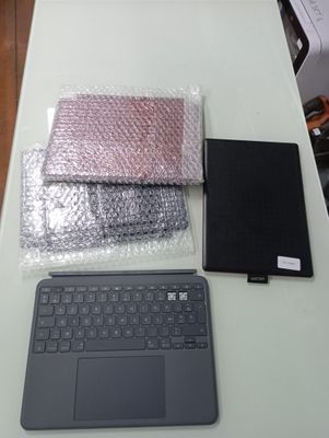 a laptop and other electronics on a table