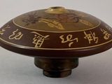 a picture of a brown and gold oriental table top