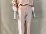 an image of a mannequin wearing a pink shirt and pants