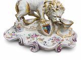 a figurine of a lion with a shield on it