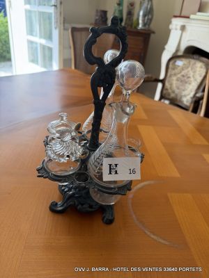 a glass vase with a clock on it on a table