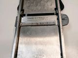 an image of a close up of a slicer on a counter
