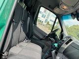 the interior of a green van with the driver ' s seat up