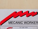 a sticker that says mechanic worker on the back of it