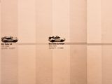 three cars that are parked on the same side of the wall