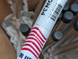 a close up of a baseball bat with a sticker on it
