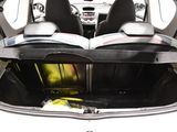 the back of a car with the trunk open and a book in the trunk
